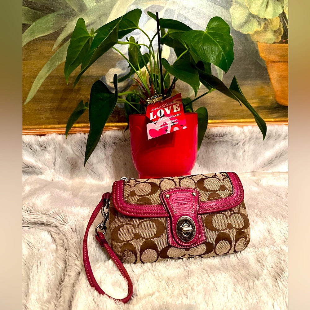 COACH LEGACY TAN MONOGRAM WRISTLET w/Magenta trim.
